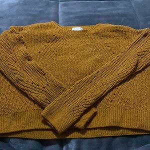Golden sweater slightly cropped